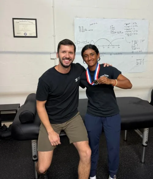 Dr. Vlad Madorsky with client Kavya K. at Physical Therapy Doc in West Boca Raton